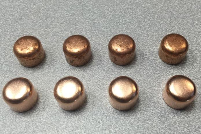 A before and after photo of brass parts after aqueous cleaning. The top row is before; the brass is dark in color, dirty, and rusted. The bottom row is after aqueous cleaning; the brass is lighter in color, shiny, and polished.